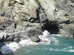 SX07124 Waves splashing by cave underneath Tintagel Castle.jpg